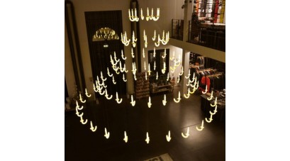 The levitating chandelier with porcelain candlesticks